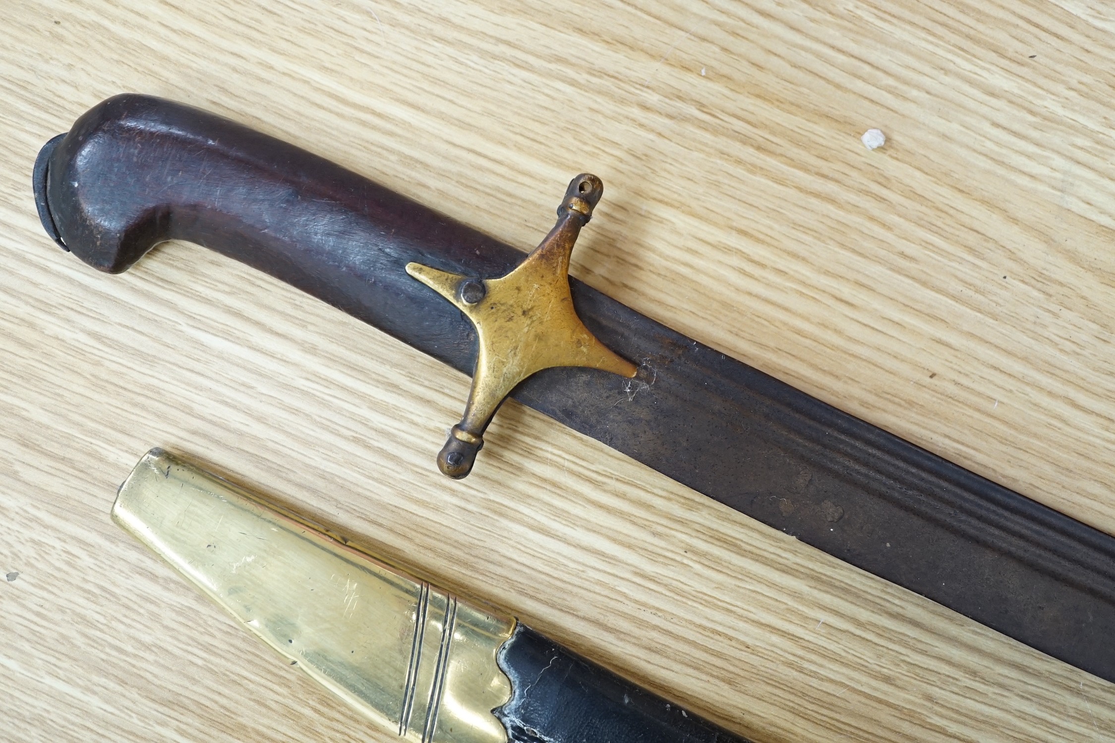 An Ottoman tulwar sabre, a European sabre and a leather whip